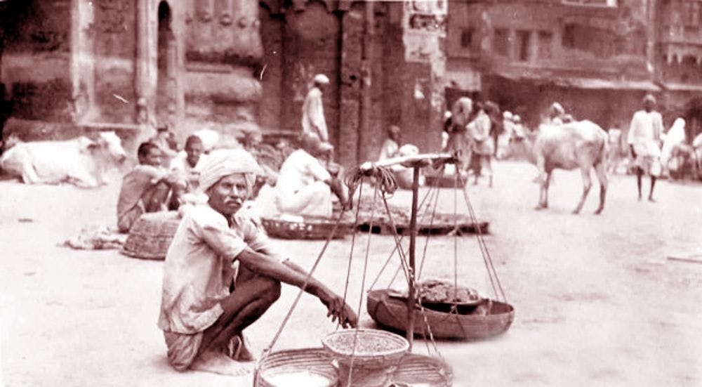 Vendor sitting at the platform of the clock tower