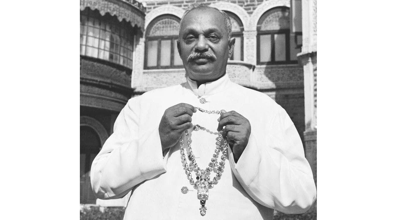 Sir Digvijaysinhji Jadeja (1895-1966) holding the Nawanagar necklace