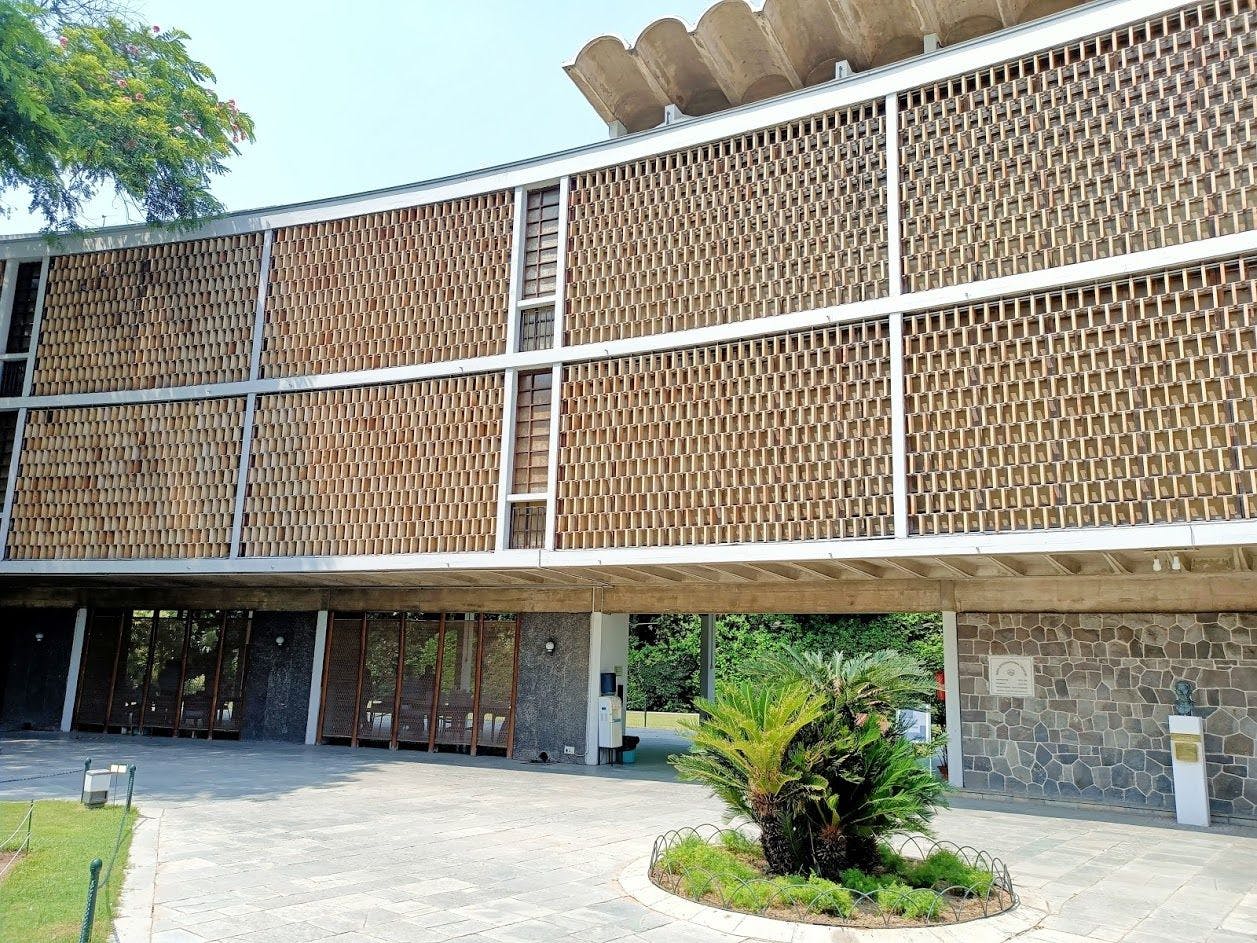 Courtyard façade with the jaali made of hand made clay bricks at India International Centre 