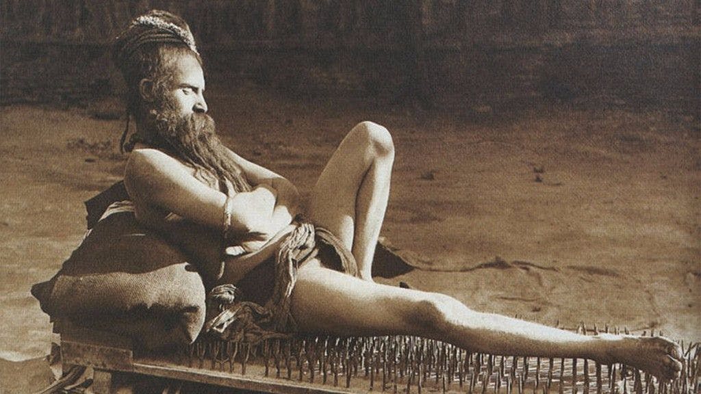 A Naga Sanyasi resting on a bed of nails